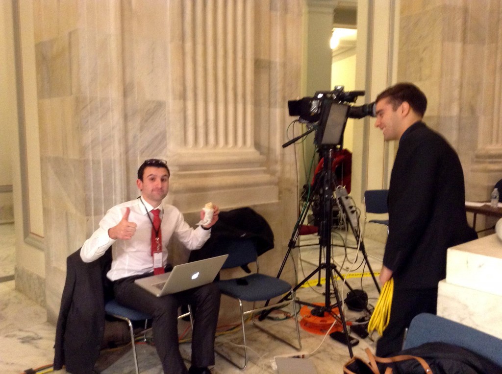 Ryan McCrimmon and Vesko Cholakov, biting a Potbelly sandwich and drafting a script, prepare for the first live shot for BiT's evening news at 8 p.m. Eastern time. (Soad Mana/Medill)